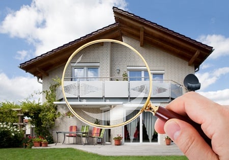 house with magnifying glass