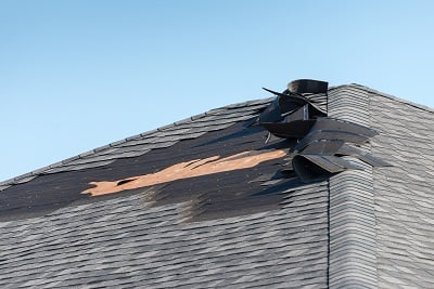 roof with group of shingles damaged