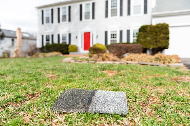 roof shingle laying in front yard